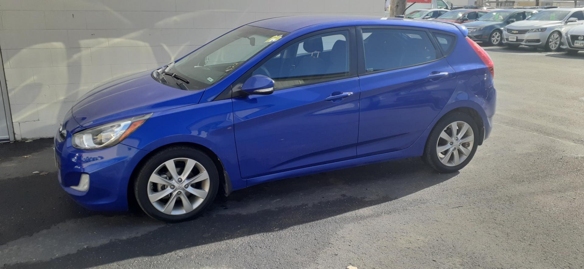 2013 Hyundai Accent SE 5-Door (KMHCU5AE2DU) with an 1.6L L4 DOHC 16V engine, located at 2015 Cambell Street, Rapid City, SD, 57701, (605) 342-8326, 44.066433, -103.191772 - CARFAX AVAILABLE - Photo#1